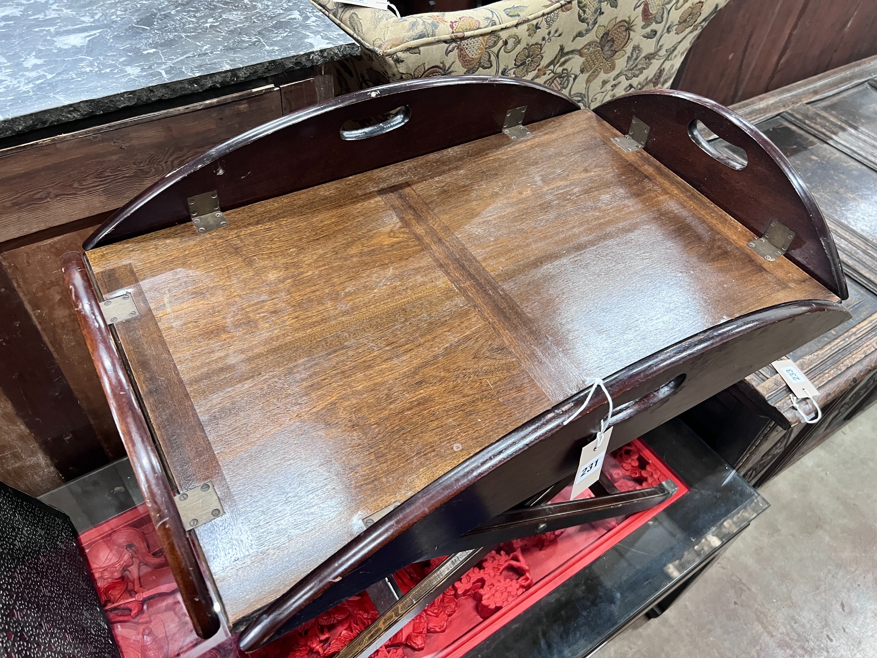 A mahogany butler's tray on folding stand, width 70cm *Please note the sale commences at 9am.